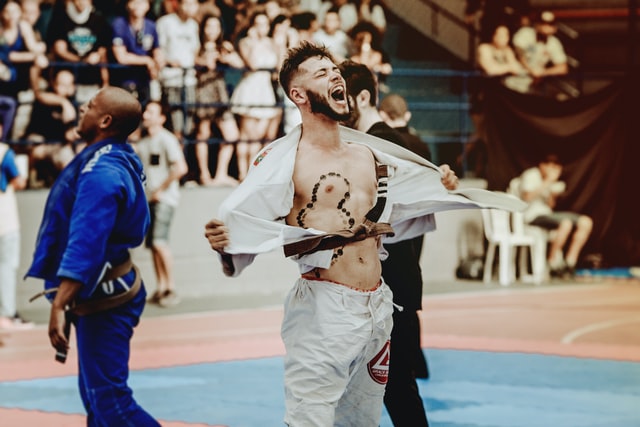 An athlete celebrating victory in a fight.